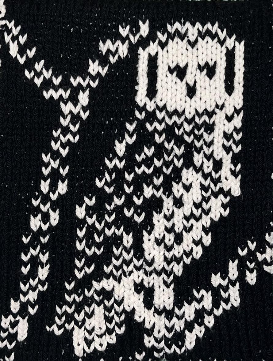 This pattern contains instructions on how to make a double-knit hand/ dish towel. The final product measures approximately 8 1/2” (22cm) by 25” (63.5 cm) and is reversible. The design is knit from a chart and contains basic instructions. It is knit using US 6 (4 1/4 mm) needles and 1 ball of Lily Sugar’n Cream cotton yarn in black and 1 ball of Lily Sugar’n Cream cotton yarn in white or other worsted weight yarn.